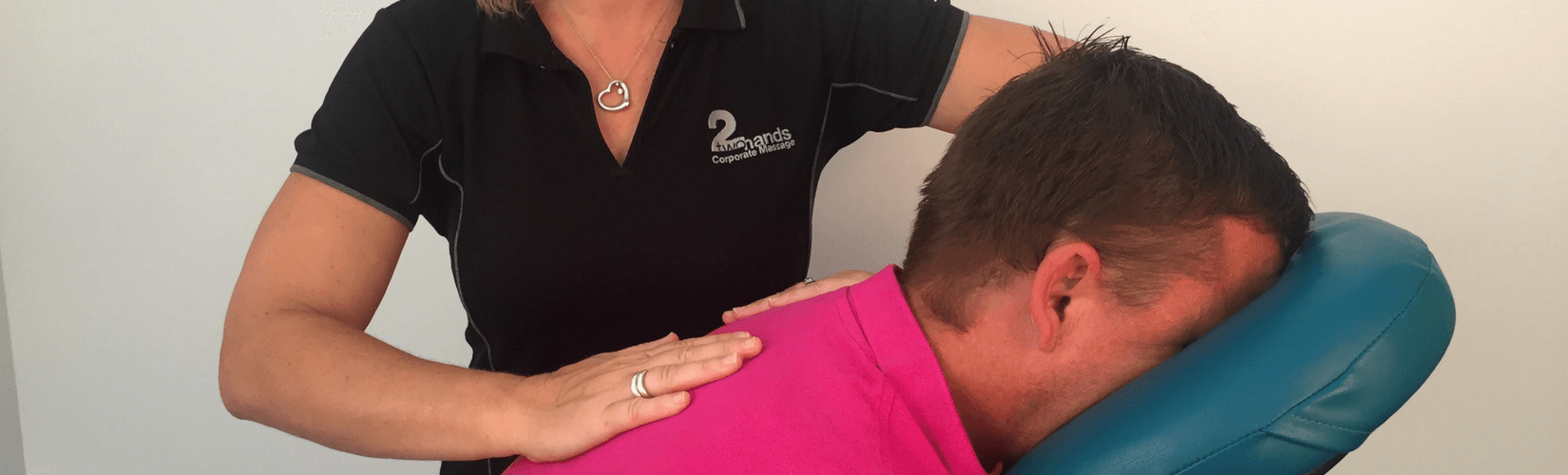 adam pink shirt no logo getting a seated massage